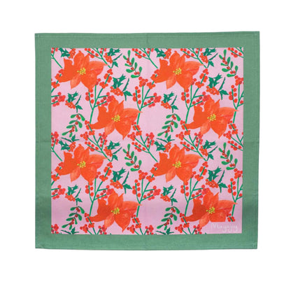 Mayajoy flat lay Christmas poinsettia, colourful, cotton napkin with pink background, hand illustrated red poinsettia and foliage and sage green trim. 