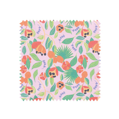 Colourful cotton tea towel swatch hand illustrated ackee print with pink background, green leaves, orange ackee and lilac thyme leaves by Mayajoy 